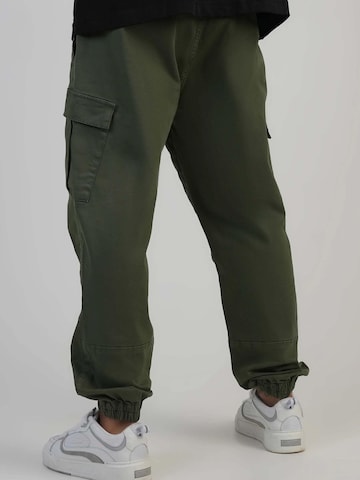 SikSilk Regular Sporthose 'Slim Fit Cargos' in Grün