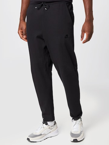 Nike Sportswear Tapered Pants in Black: front