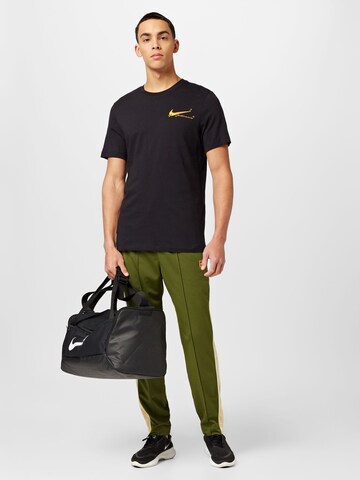 NIKE Regular Sports trousers 'Court HERITAGE' in Green