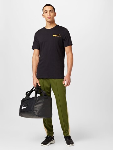 Regular Pantalon de sport NIKE en vert