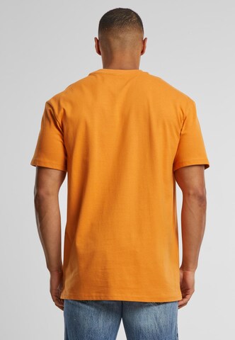 Merchcode Shirt 'Think Different' in Orange