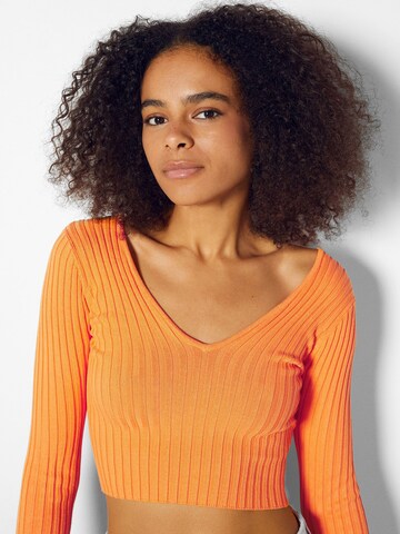 Bershka Sweter w kolorze pomarańczowy