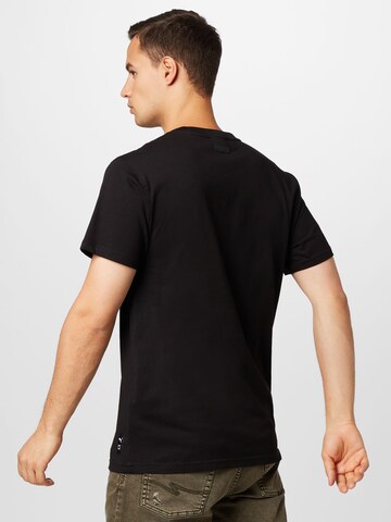 PUMA Sportshirt 'Rebound' in Schwarz