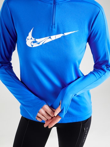 NIKE Performance shirt 'Swoosh' in Blue