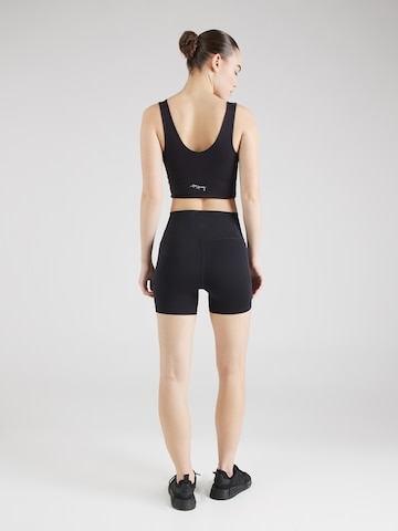 UNDER ARMOUR Skinny Sportbroek 'Meridian Middy' in Zwart