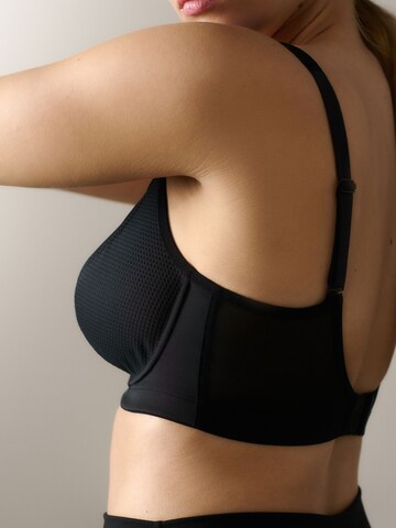Invisible Soutien-gorge de sport Next en noir