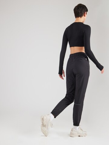 Tapered Pantaloni sportivi 'MEUVO' di Rukka in nero