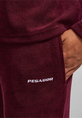 Wide leg Pantaloni 'Noli' di Pegador in rosso