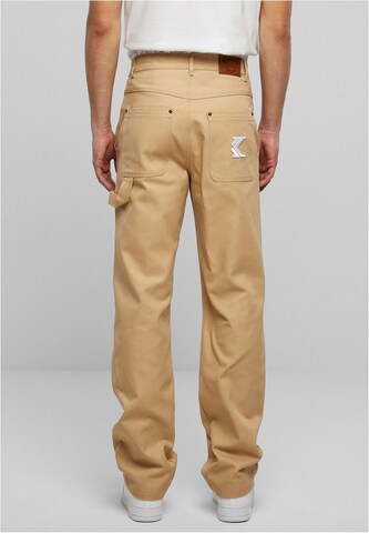 Karl Kani Regular Trousers in Beige