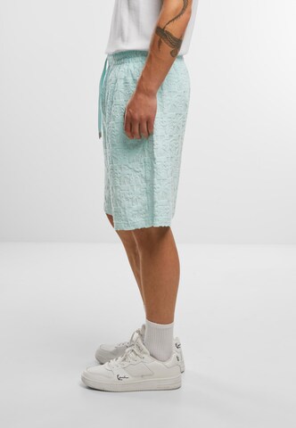 Loosefit Pantalon Karl Kani en vert