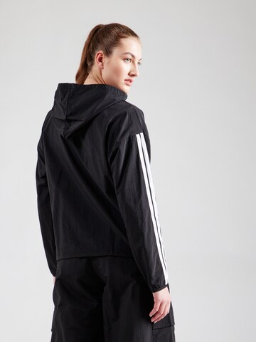 ADIDAS SPORTSWEAR - Chaqueta deportiva en negro
