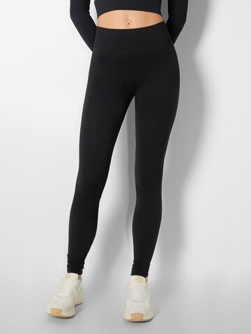 Bershka Skinny Leggings in Black: front