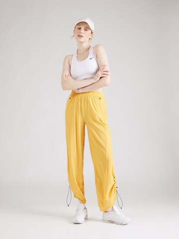 Effilé Pantalon de sport 'MURTO' Rukka en jaune