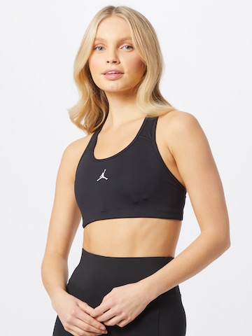 NIKE Regular Sports Bra in Black: front