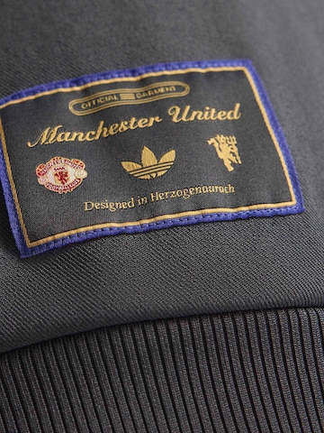 ADIDAS ORIGINALS - Sudadera con cremallera deportiva 'Manchester United Terrace Icons' en negro