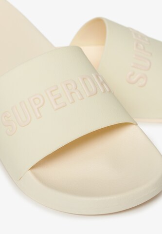 Claquettes / Tongs Superdry en blanc