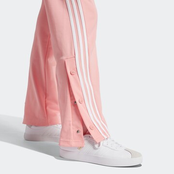 ADIDAS SPORTSWEAR Boot cut Workout Pants in Orange