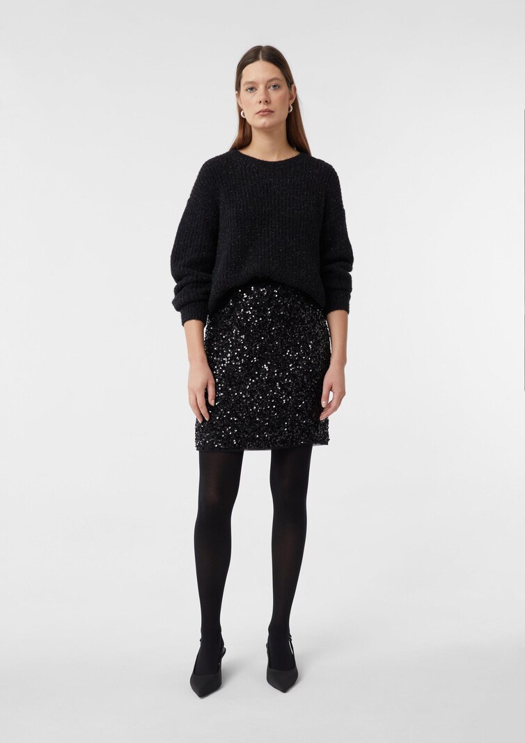 Black sequin mini skirt with soft sweater for a playful date night