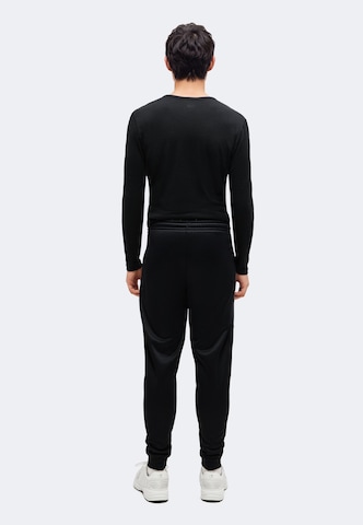 juoda UNDER ARMOUR Siaurėjantis Sportinės kelnės 'Fleece® Utility'