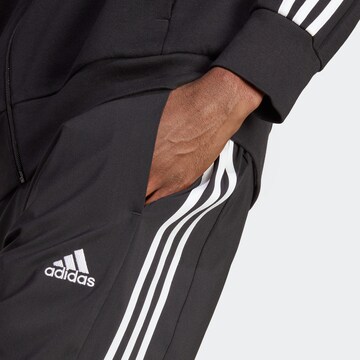 ADIDAS SPORTSWEAR Tapered Παντελόνι φόρμας 'Essentials' σε μαύρο