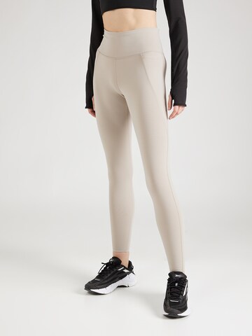 Skinny Pantalon de sport 'LUX' Reebok en beige : devant