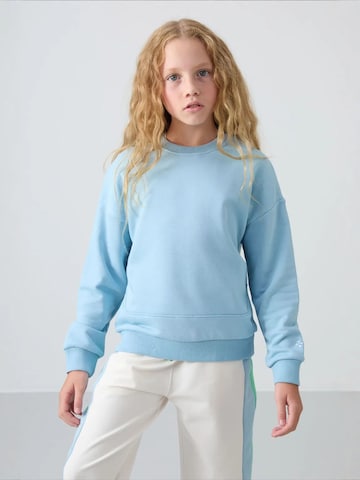 Tommy Life Bluzka sportowa 'TOMMY Jugend-Unisex-Sweatshirt Aus Baumwollmischung' w kolorze niebieski