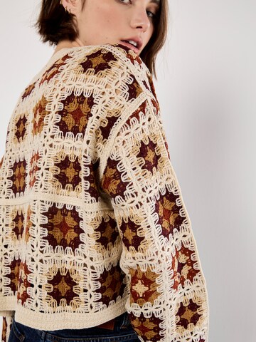 Pull-over ' ' Apricot en gris