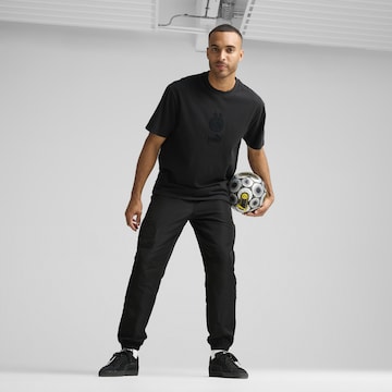 PUMA Tapered Sportbroek in Zwart