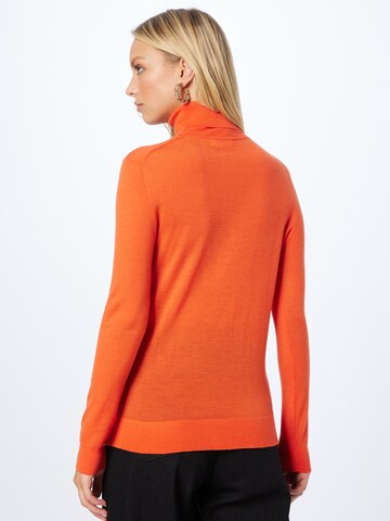 Pullover di Calvin Klein in arancione