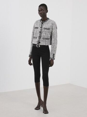 MANGO Välikausitakki 'Ditor' värissä musta