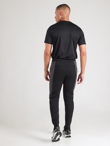 Nike Sportswear Tapered Trousers 'Tech Fleece' in Black