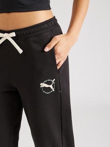 PUMA Tapered Sportbroek in Zwart