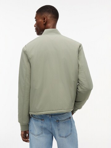 Tommy Jeans Átmeneti dzseki - zöld