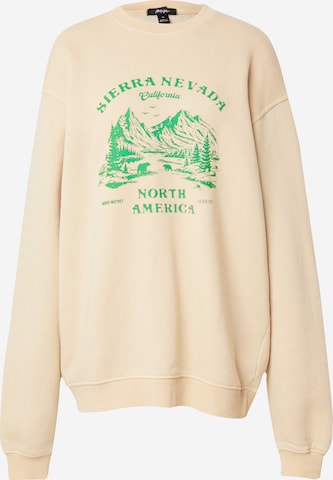 Sweat-shirt 'Sierra Nevadat' Nasty Gal en beige : devant