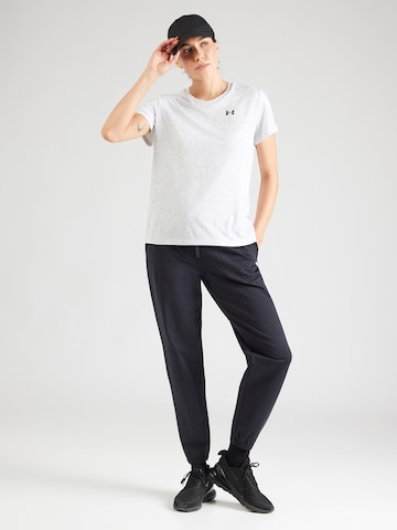 UNDER ARMOUR Tapered Sports trousers in Black