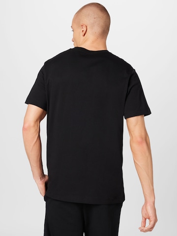 JACK WOLFSKIN Λειτουργικό μπλουζάκι 'ESSENTIAL' σε μαύρο
