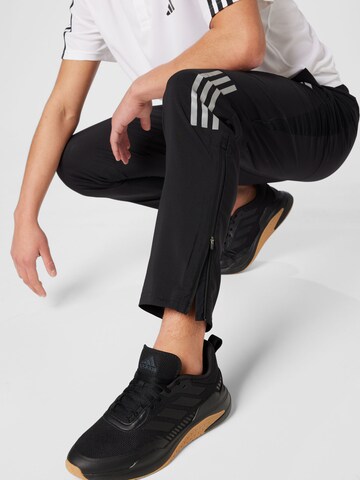 ADIDAS PERFORMANCE Tapered Sports trousers 'Own The Run Astro' in Black