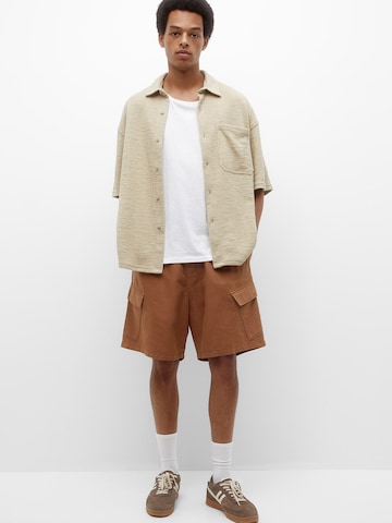 Pull&Bear Loose fit Cargo trousers in Brown: front