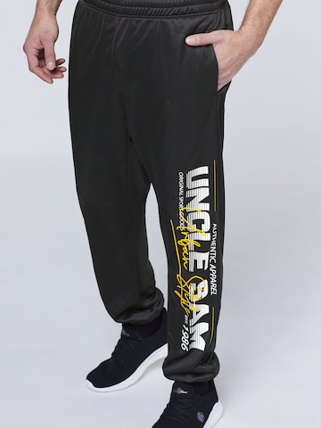 UNCLE SAM Tapered Pants in Black: front
