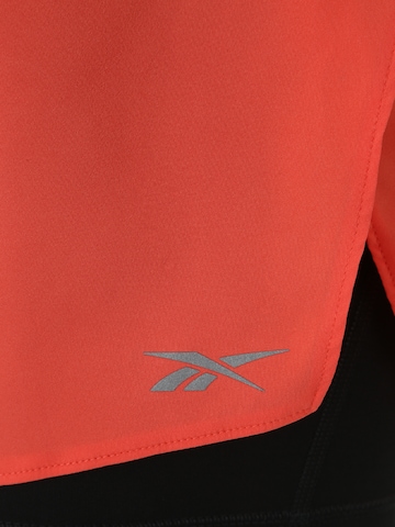 Reebok Skinny Sports trousers in Orange