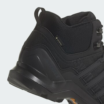 Boots 'Swift R2' di ADIDAS PERFORMANCE in nero