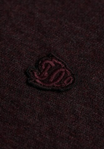 Veste de survêtement 'Essential' Superdry & Co en rouge