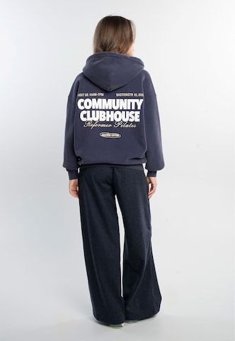 Another Cotton Lab - Sudadera con cremallera 'Community Clubhouse' en azul