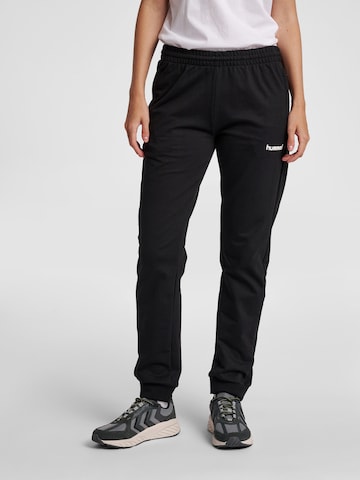 Tapered Pantaloni sportivi di Hummel in nero: frontale