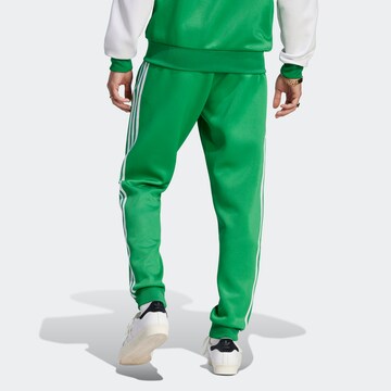 ADIDAS ORIGINALS Tapered Broek 'Adicolor Classics+ Sst' in Groen