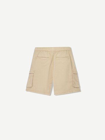 Bershka Loose fit Cargo trousers in Yellow