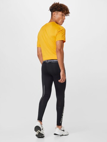 NIKE Skinny Spodnie sportowe w kolorze czarny