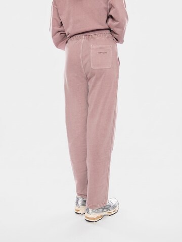 Carhartt WIP Luźne Spodnie 'W Benton Sweat Pant' w kolorze różowy