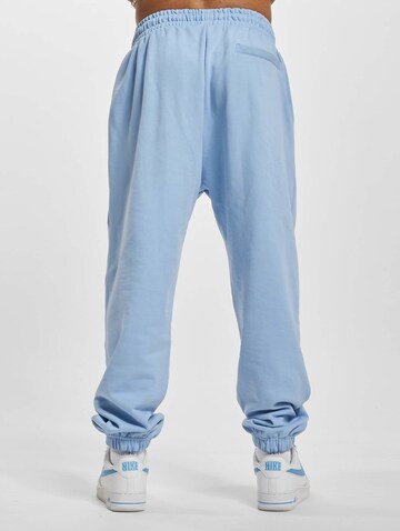 Tapered Pantaloni 'Def' di Urban Classics in blu