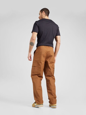 Loosefit Pantaloni cargo 'Club' di Nike Sportswear in marrone